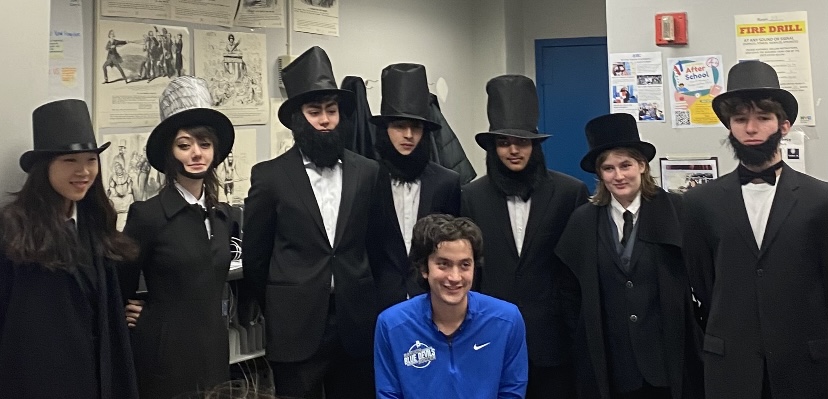 The Lincolns in one of Jacob’s AP U.S. History classes. (Lincolns from left to right: Maggie Lee, Kat Valentine, Sam Wagman, Santo Falconieri, Zidan Mahmud, Margaret Macdonald and Lucas Roberts. Also pictured: John Jacobs.)