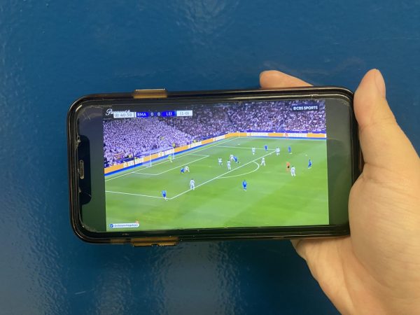 A phone plays highlights from Wednesdays game between Real Madrid and RB Leipzig.
