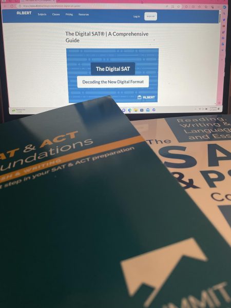 An SAT textbook sits in front of the  online prep platform those in Ross and Daviss course use.