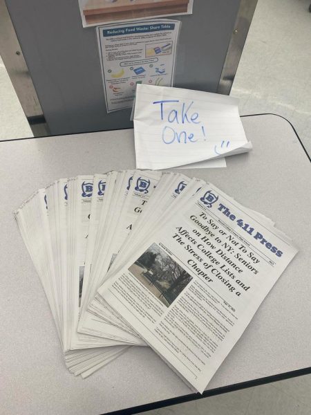 Copies of The 411 Presss print edition from earlier this school year were placed in the cafeteria.