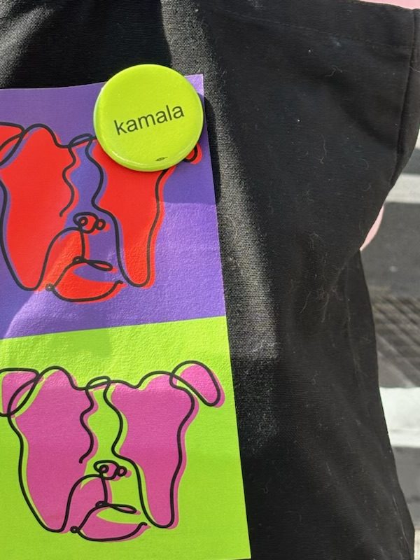 New Yorker sporting "brat" inspired Kamala pin.