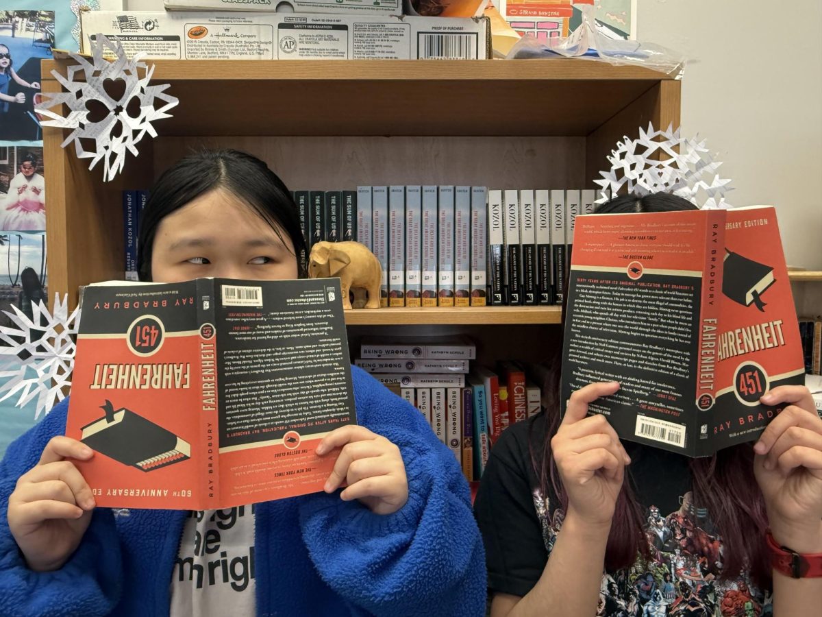 Students posed with "Fahrenheit 451" by Ray Bradbury.