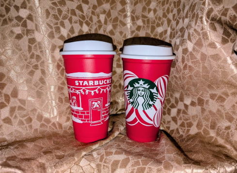 Two reusable Starbucks cups distributed on Red Cup Day. 