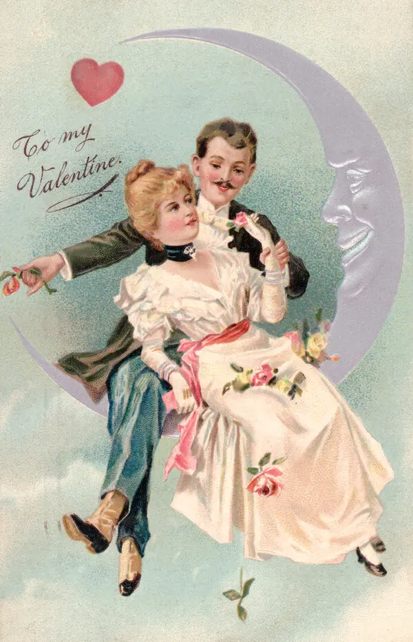 A vintage Victorian Valentine’s card of a couple sitting on a crescent moon.
