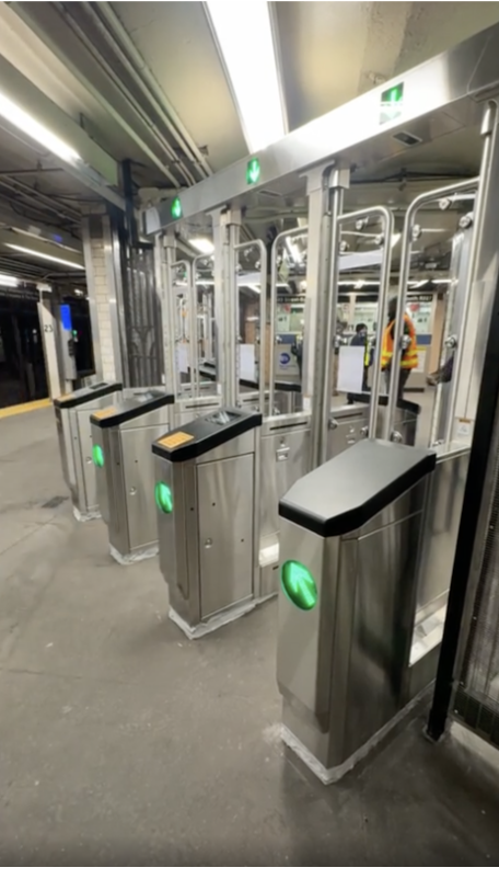 New turnstiles at the 23rd station. 