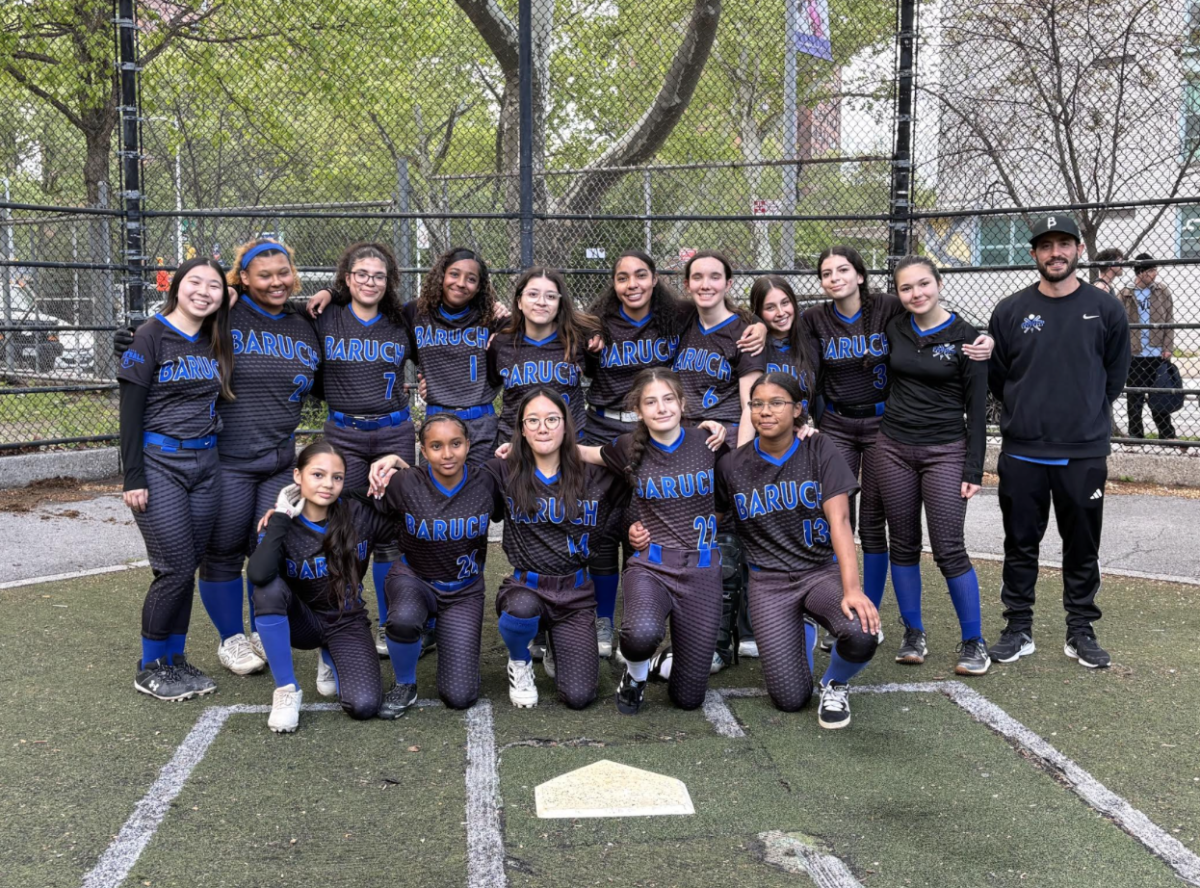 The girls softball team posing for a picture.